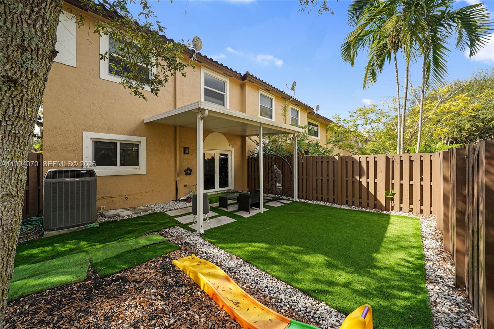 12763 Southwest 50th Street Miramar, FL 33027 - Photo 15 of 38 a view of a house with backyard and porch