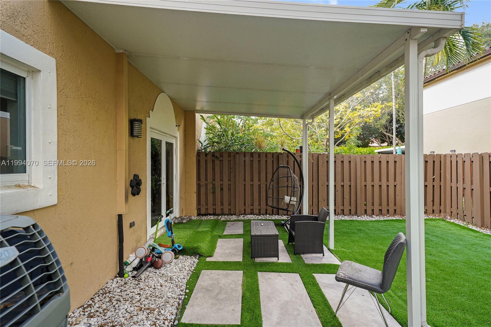 12763 Southwest 50th Street Miramar, FL 33027 - Photo 16 of 38 a view of a backyard with a garden