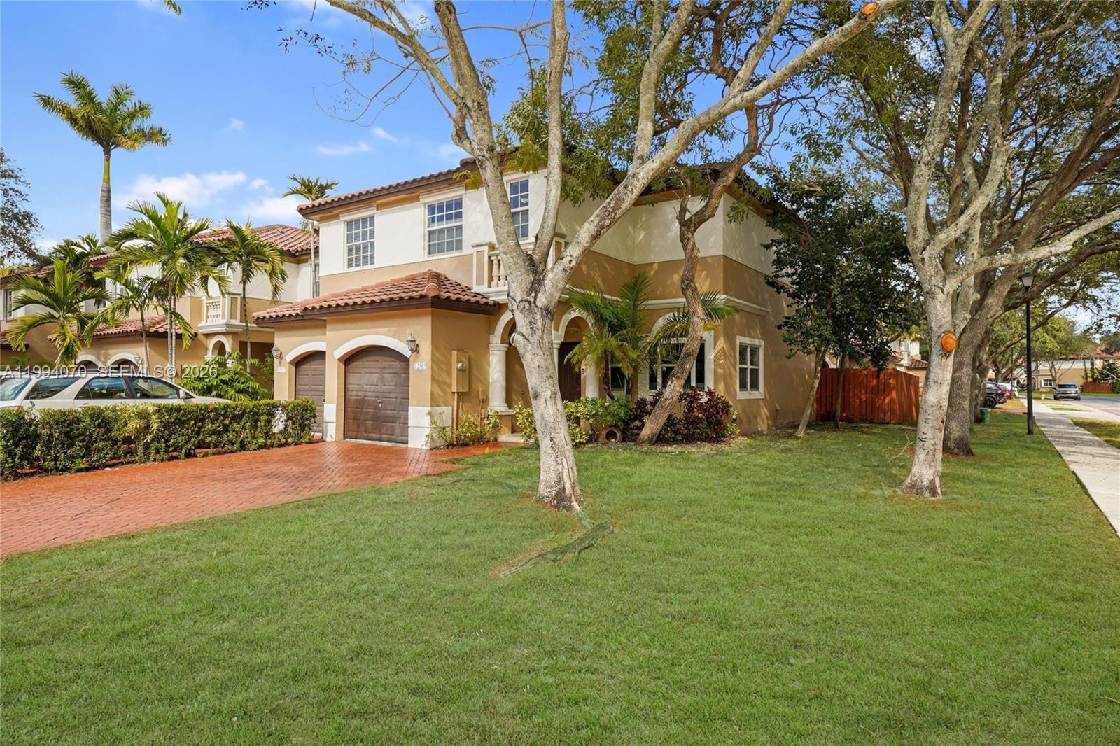 12763 Southwest 50th Street Miramar, FL 33027 - Photo 32 of 38 a house with garden in front of it