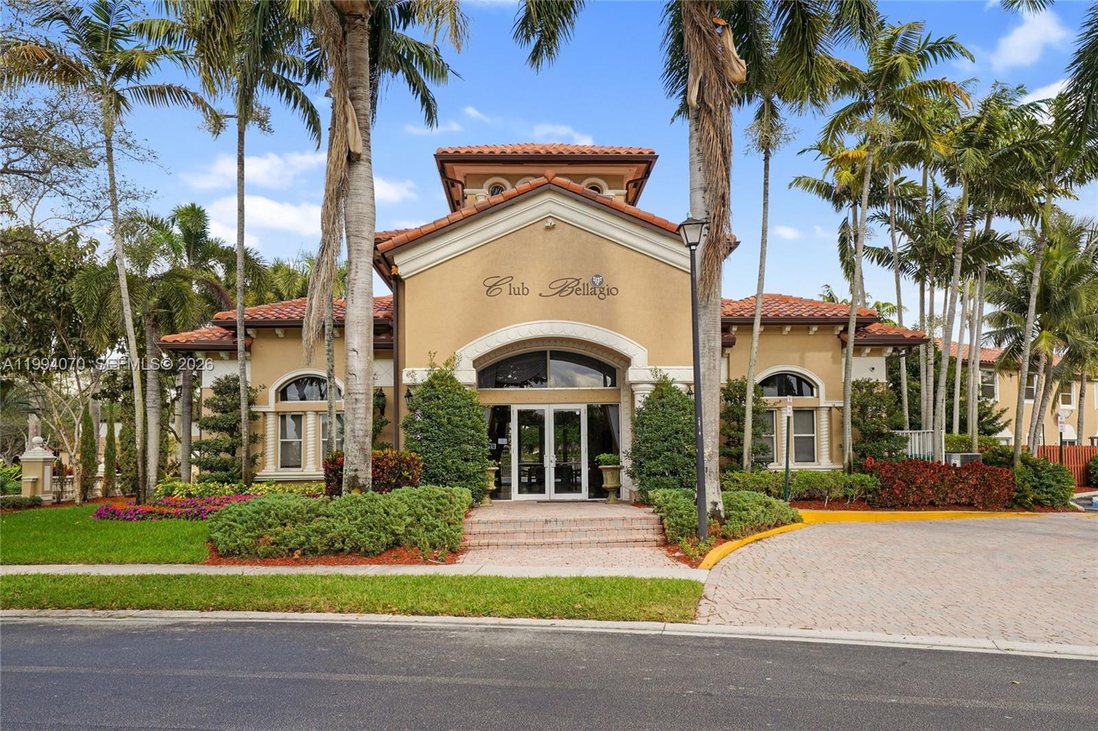 12763 Southwest 50th Street Miramar, FL 33027 - Photo 33 of 38 a front view of a house with a garden