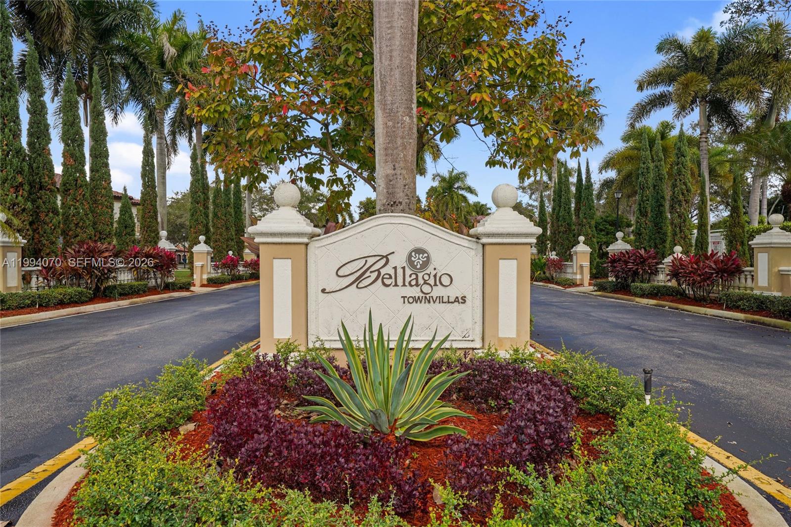 12763 Southwest 50th Street Miramar, FL 33027 - Photo 34 of 38 a sign that is sitting in front of flowers