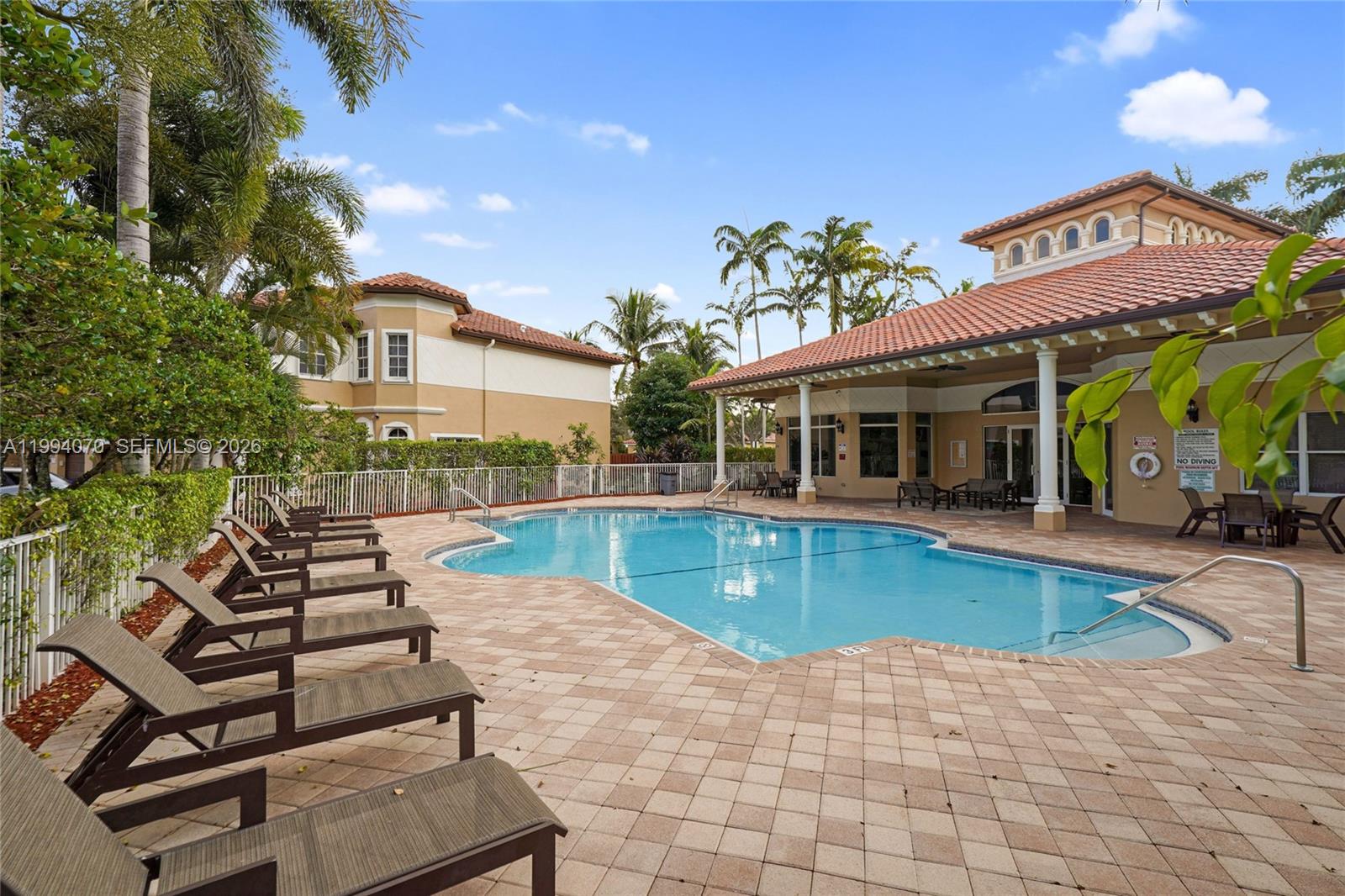12763 Southwest 50th Street Miramar, FL 33027 - Photo 36 of 38 a view of a house with swimming pool and sitting area