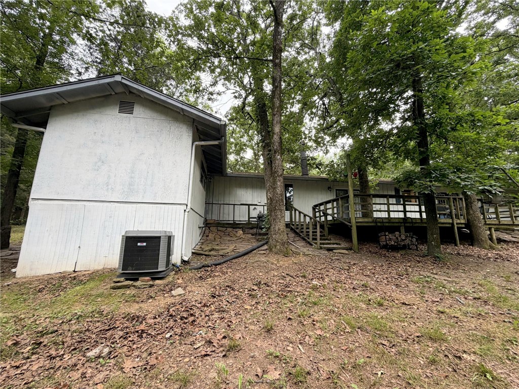 5108 Ridge Road Alma, AR 72921 - Photo 29 of 33 Exterior siding with a gabled roofline and an outdoor deck with wood railings