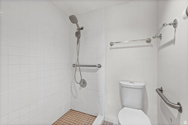 2244 North Canyon Road, Unit 212 Provo, UT 84604 - Photo 14 of 31 White subway tile shower surround with a handheld shower fixture