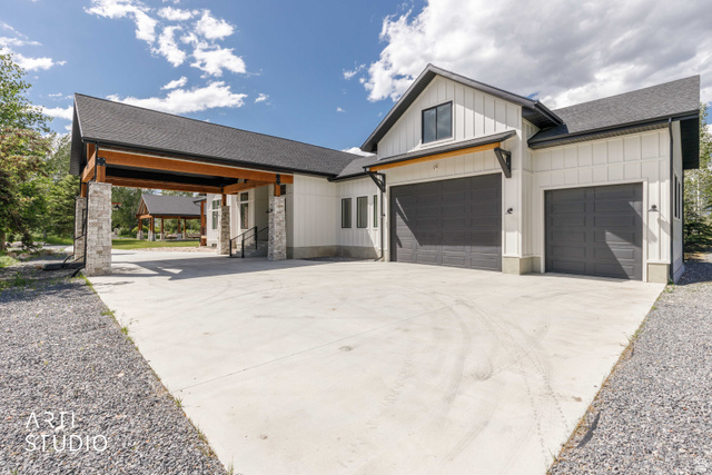 1188 South Old Trappers Loop Road Huntsville, UT 84317 - Photo 15 of 92 Modern farmhouse exterior featuring board and batten siding, dark-framed windows, and a black shingled roof