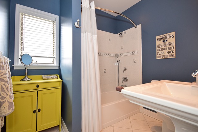 260 Addison Road Riverside, IL 60546 - Photo 14 of 25 a bathroom with a granite countertop sink and a shower