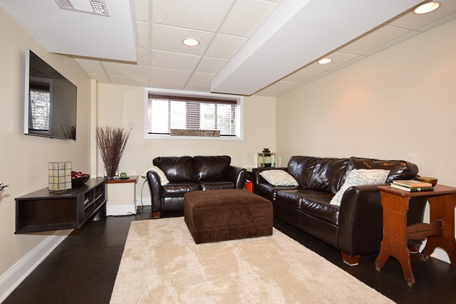 260 Addison Road Riverside, IL 60546 - Photo 19 of 25 a living room with furniture a fireplace and a flat screen tv