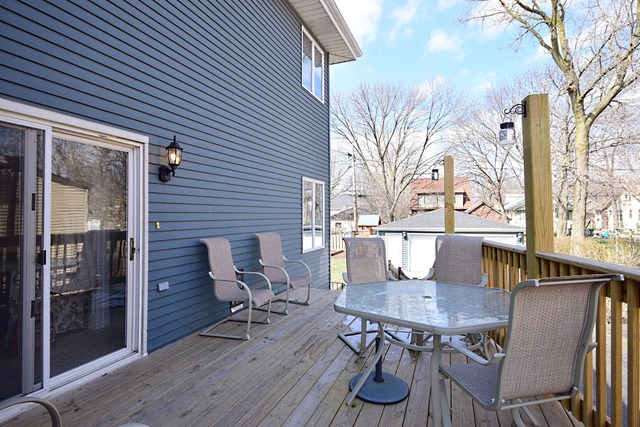 260 Addison Road Riverside, IL 60546 - Photo 23 of 25 a view of a patio with table and chairs and potted plants