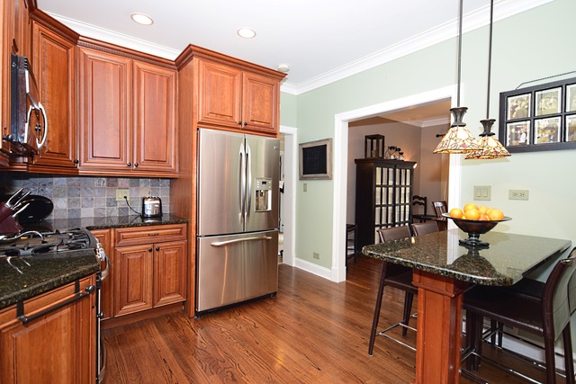 260 Addison Road Riverside, IL 60546 - Photo 8 of 25 a kitchen with stainless steel appliances granite countertop a refrigerator stove top oven and sink