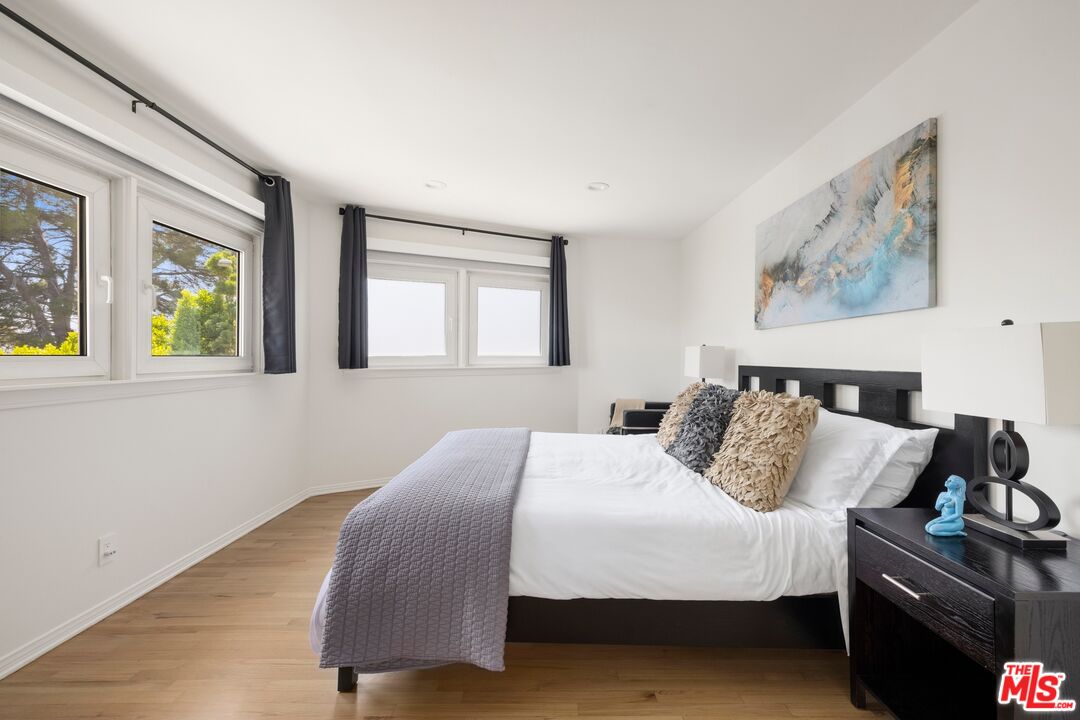 1244 Stradella Road Los Angeles, CA 90077 - Photo 13 of 31 a bedroom with a bed and a window