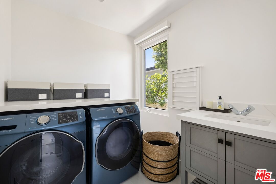 1244 Stradella Road Los Angeles, CA 90077 - Photo 17 of 31 a utility room with sink dryer and washer