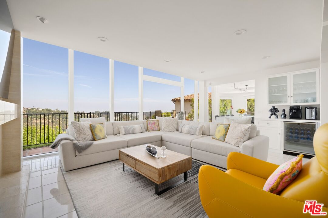 1244 Stradella Road Los Angeles, CA 90077 - Photo 2 of 31 a living room with furniture wooden floor and a table