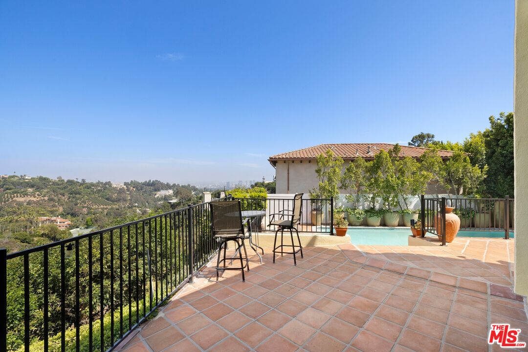 1244 Stradella Road Los Angeles, CA 90077 - Photo 23 of 31 a view of a balcony with chairs