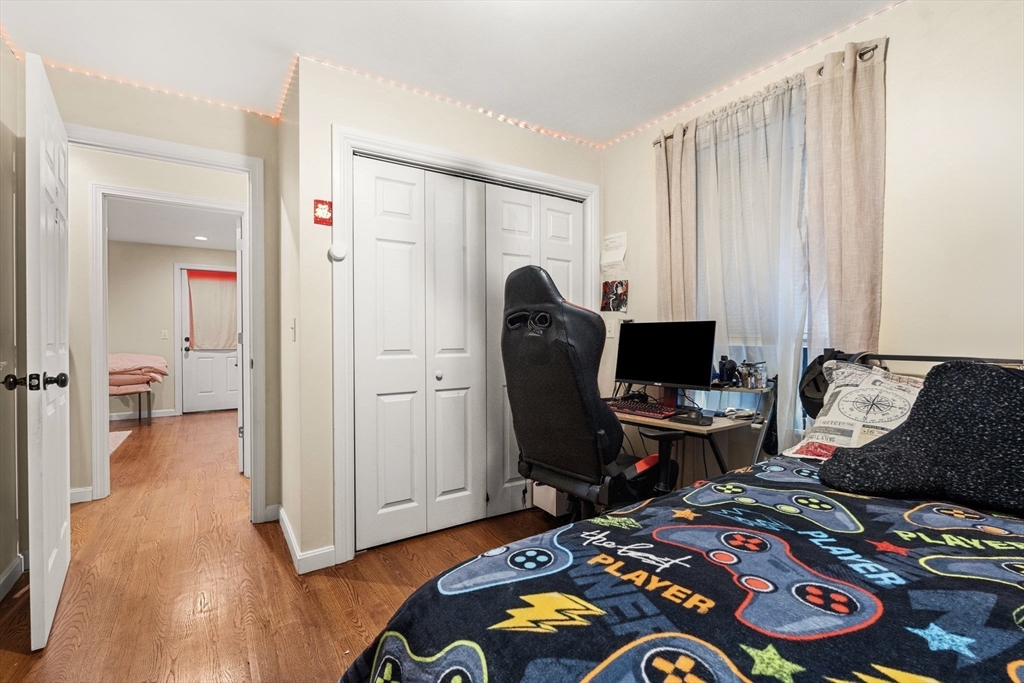 883 Grinnell Street Fall River, MA 02721 - Photo 12 of 41 a bedroom with a bed and furniture