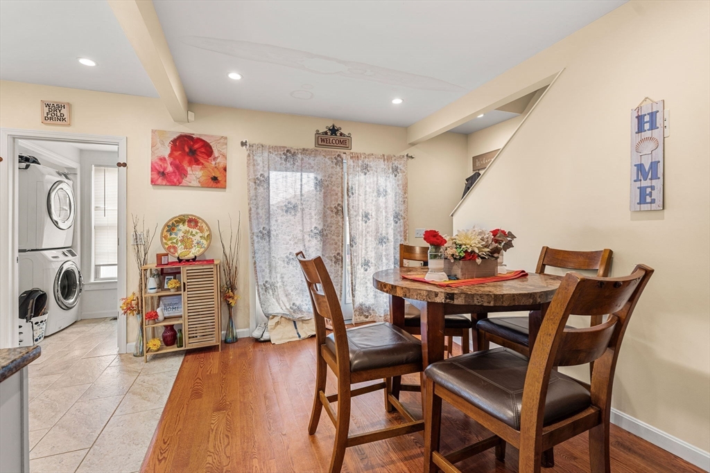883 Grinnell Street Fall River, MA 02721 - Photo 18 of 41 a view of a dining room with furniture and a chandelier