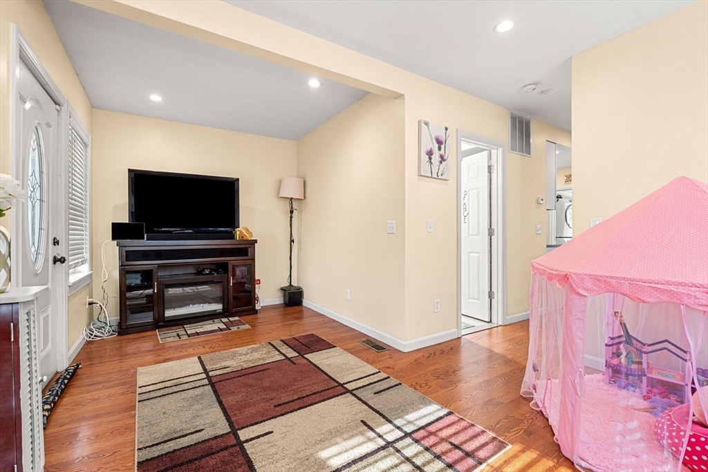 883 Grinnell Street Fall River, MA 02721 - Photo 21 of 41 a living room with furniture and a flat screen tv