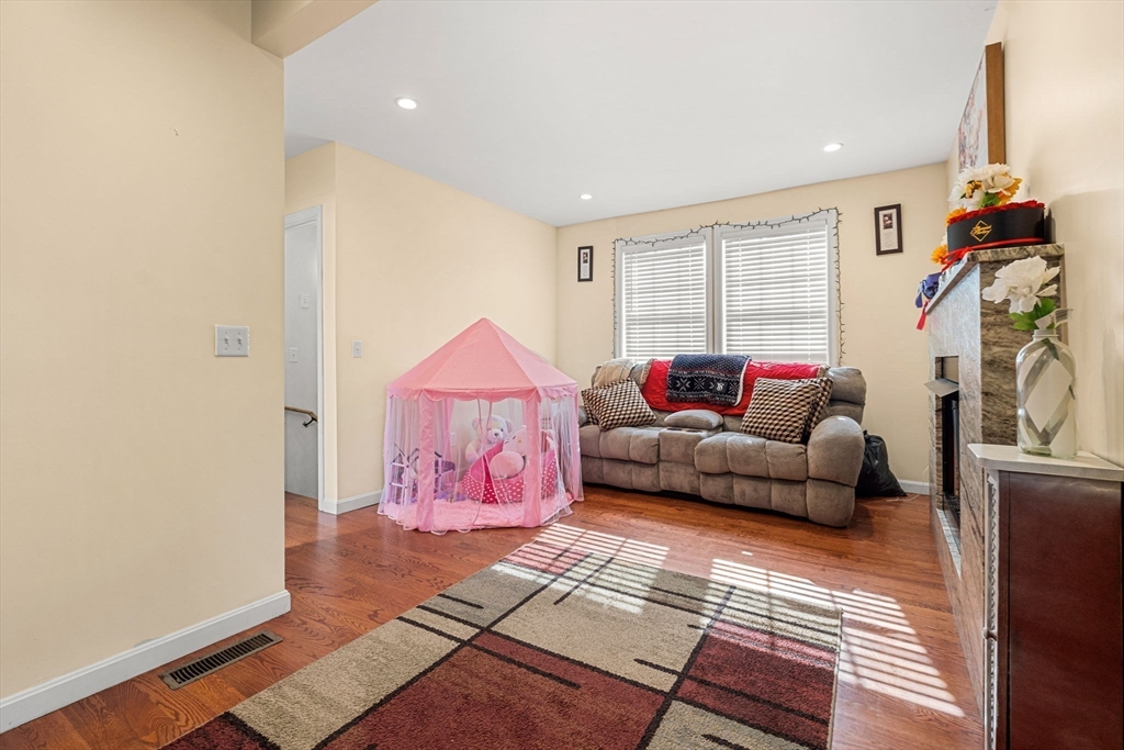 883 Grinnell Street Fall River, MA 02721 - Photo 22 of 41 a living room with furniture and a window