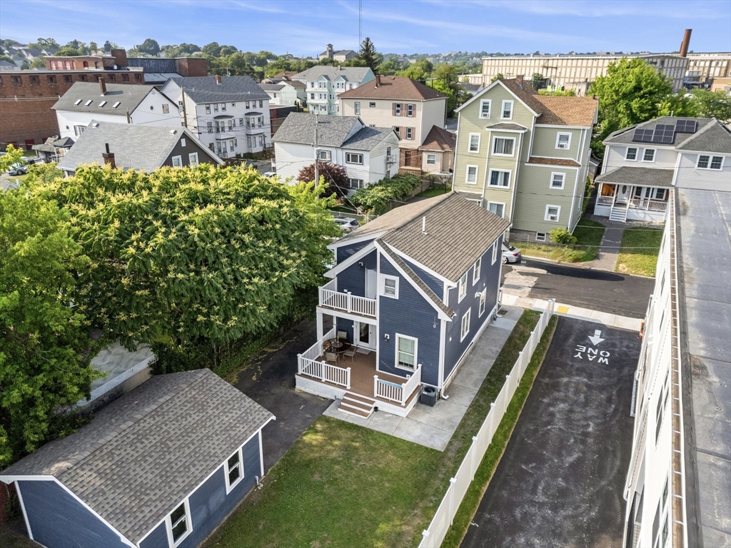 883 Grinnell Street Fall River, MA 02721 - Photo 33 of 41 an aerial view of a house with a big yard