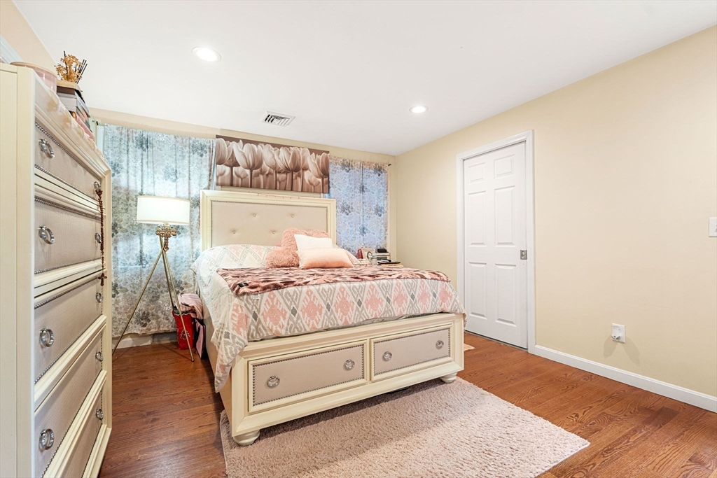 883 Grinnell Street Fall River, MA 02721 - Photo 6 of 41 a room with a bed and a painting on the wall