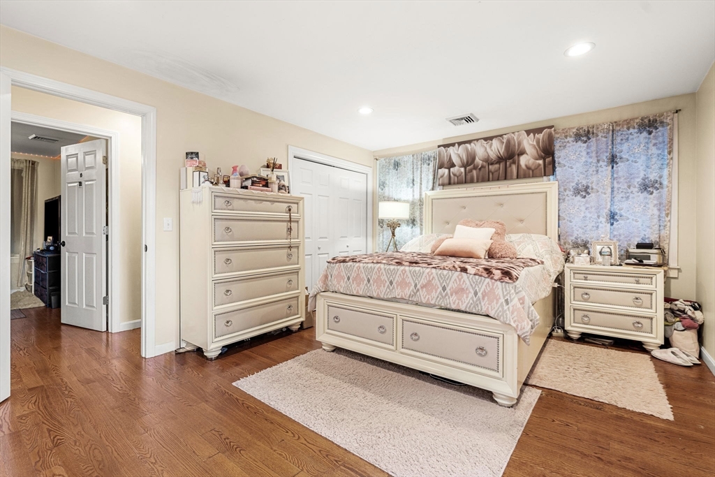 883 Grinnell Street Fall River, MA 02721 - Photo 7 of 41 a bedroom with a bed and a walk in closet