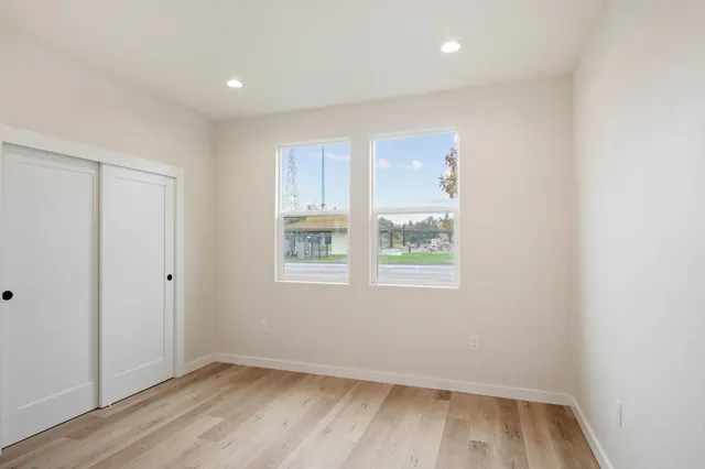 a view of room with window and hardwood floor