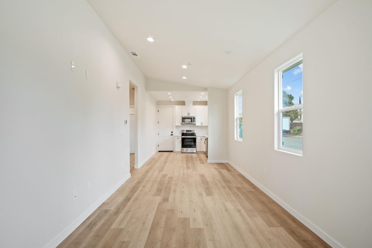 243 East 3rd Street Tracy, CA 95376 - Photo 29 of 29 a view of a big room with wooden floor and windows