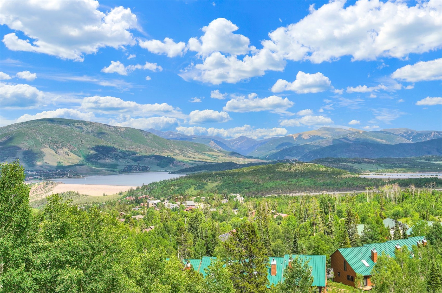7031 Ryan Gulch Road, Unit 301 Silverthorne, CO 80498 - Photo 6 of 37 a view of a lake from a yard