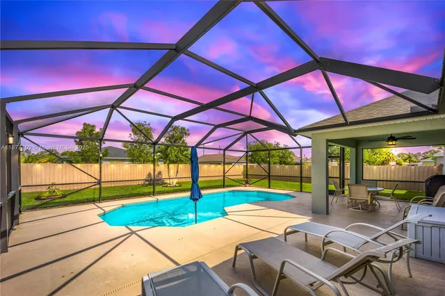 a view of yard with patio