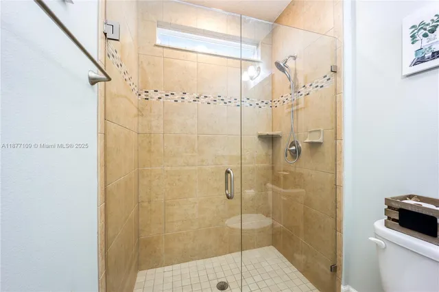 a bathroom with a shower and a sink