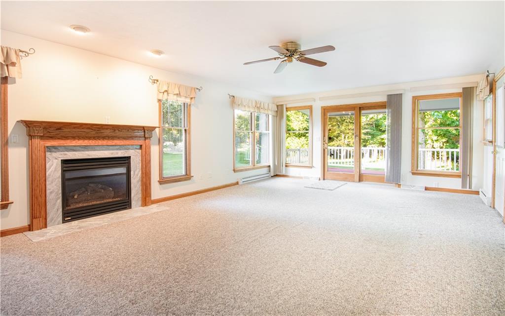 523 Meridian Road Renfrew, PA 16053 - Photo 9 of 29 a view of an empty room with a fireplace and a window