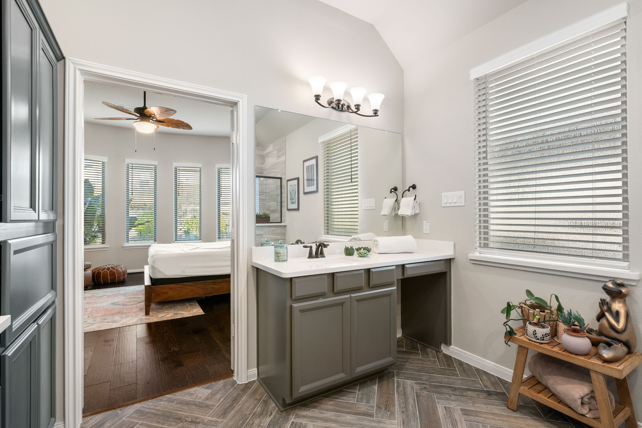 17525 Sunset Skies Road Conroe, TX 77302 - Photo 20 of 50 Primary Bath features Herringbone pattern tile floor, designer paint selection, double sinks, large walk-in shower, a freestanding tub, and a generous walk-in closet.