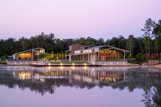 swimming pool view with a seating space