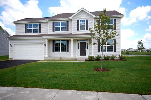 3058 Patterson Road Montgomery, IL 60538 - Photo 1 of 1 a front view of a house with a garden