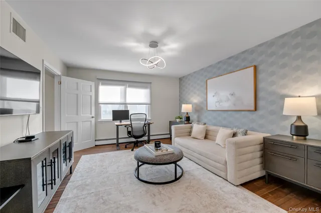 a living room with furniture and a large window