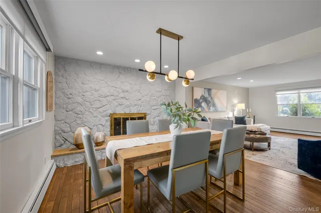 a view of a dining room with furniture wooden floor and chandelier