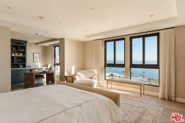 a spacious bathroom with a tub a double vanity and a shower