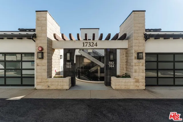 a front view of a house with stairs