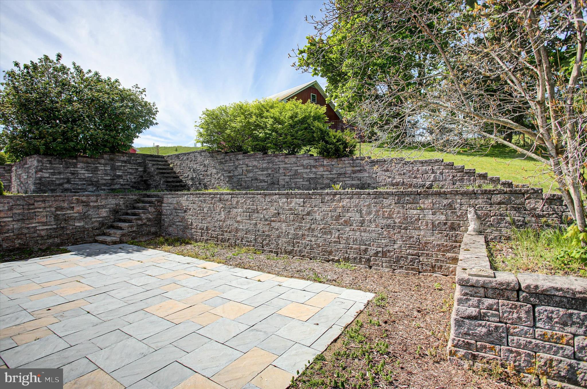 120 North Winding Road Wellsville, PA 17365 - Photo 18 of 66 Rear Paver Courtyard & Retaining Walls