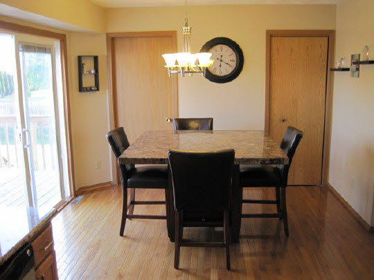 2302 Edge Rock Road Rockton, IL 61072 - Photo 7 of 11 a view of a dining room with furniture window and wooden floor