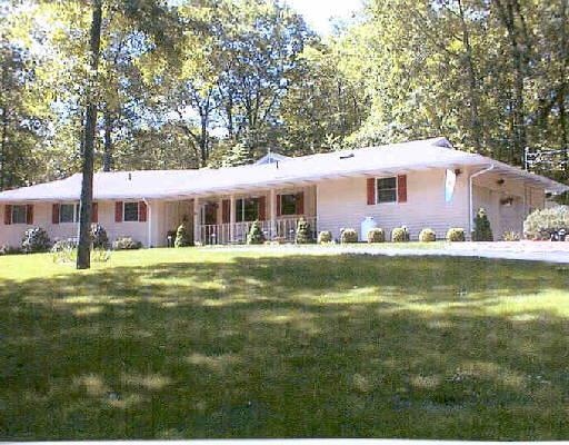 a front view of a house with swimming pool