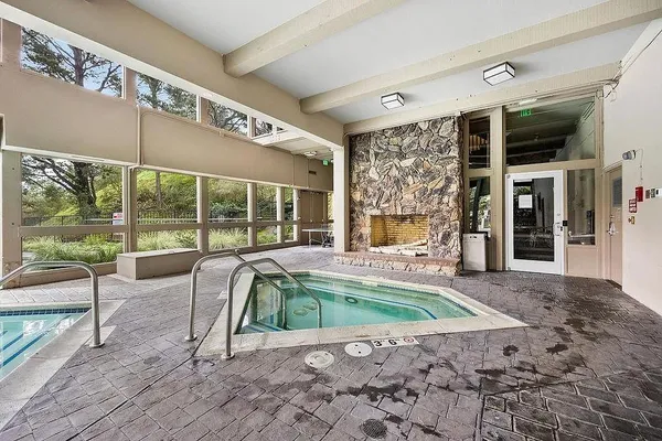 a view of a swimming pool with chairs