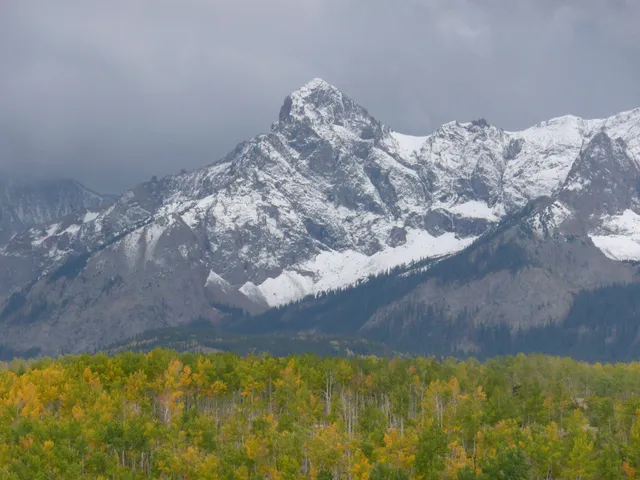 a view of a chairs and table in a patio