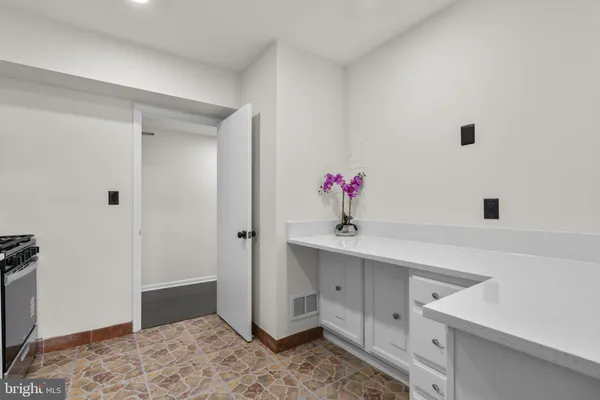 a kitchen with a sink and cabinets