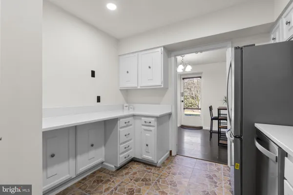 a spacious bathroom with a double vanity sink a mirror and a shower