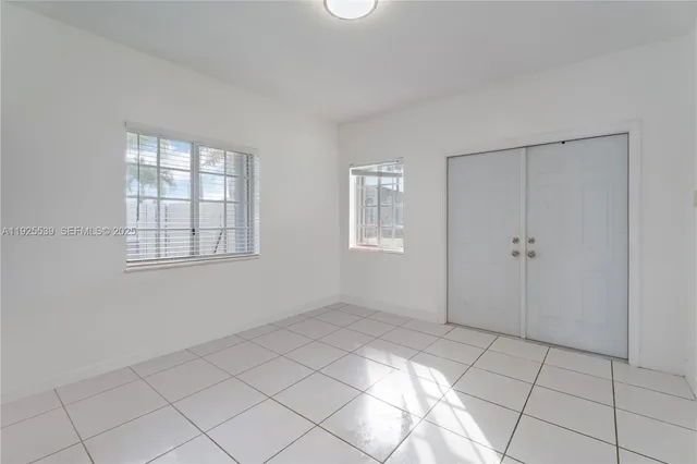 an empty room with windows