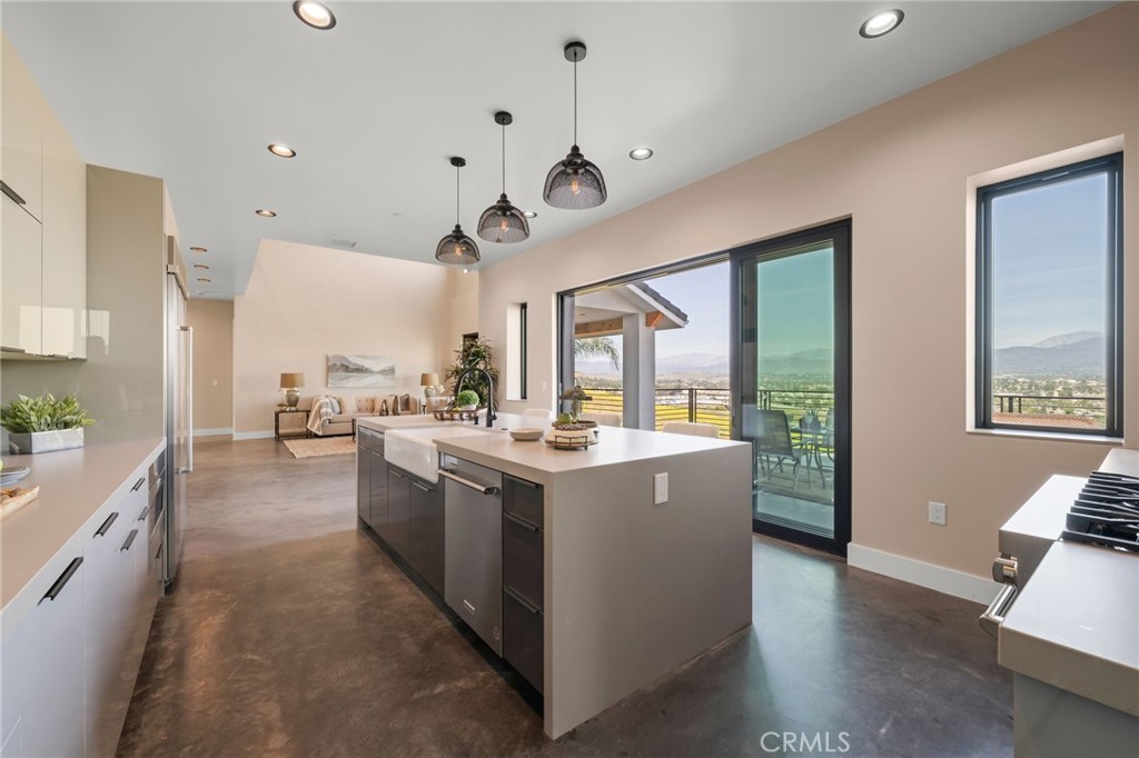 2380 Scenic Ridge Drive Chino Hills, CA 91709 - Photo 23 of 64 a view of a kitchen with kitchen island a stove a sink a refrigerator and a view of living room