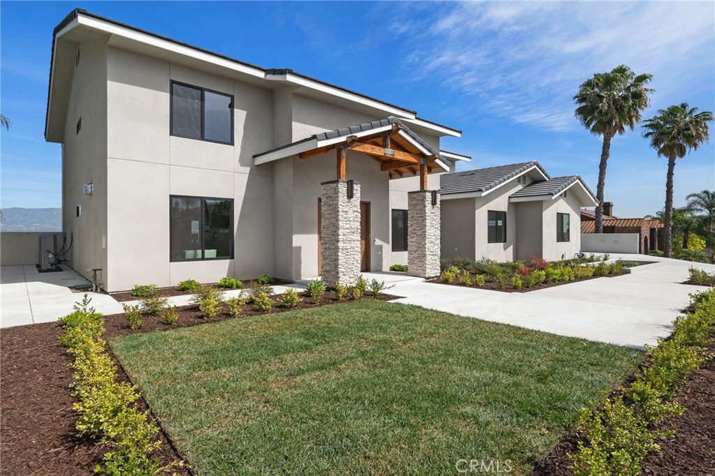 2380 Scenic Ridge Drive Chino Hills, CA 91709 - Photo 3 of 64 a front view of a house with a yard