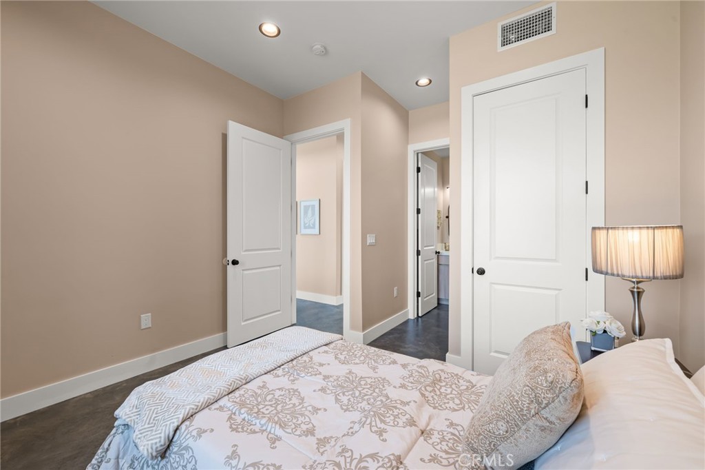 2380 Scenic Ridge Drive Chino Hills, CA 91709 - Photo 44 of 64 a bedroom with a bed and a lamp