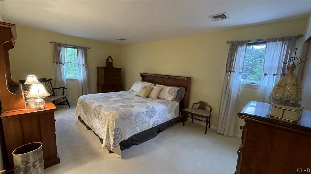 1145 Church Road Wind Gap, PA 18091 - Photo 18 of 24 a bedroom with a bed and wooden floor