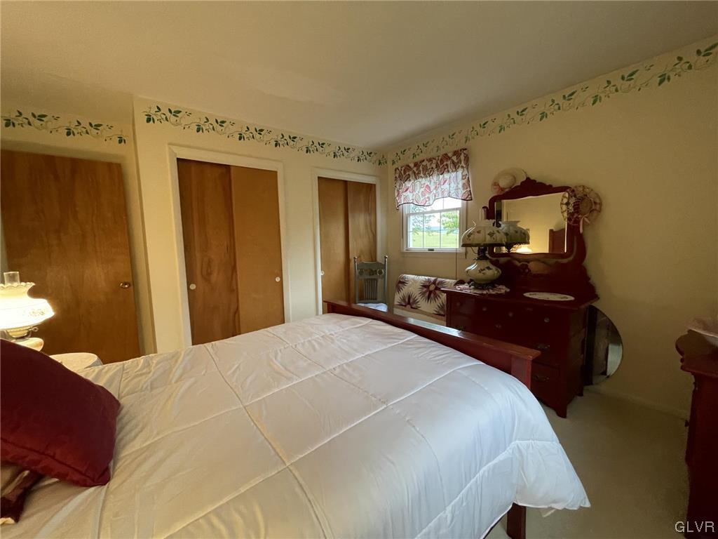 1145 Church Road Wind Gap, PA 18091 - Photo 21 of 24 a bedroom with a bed and wooden floor